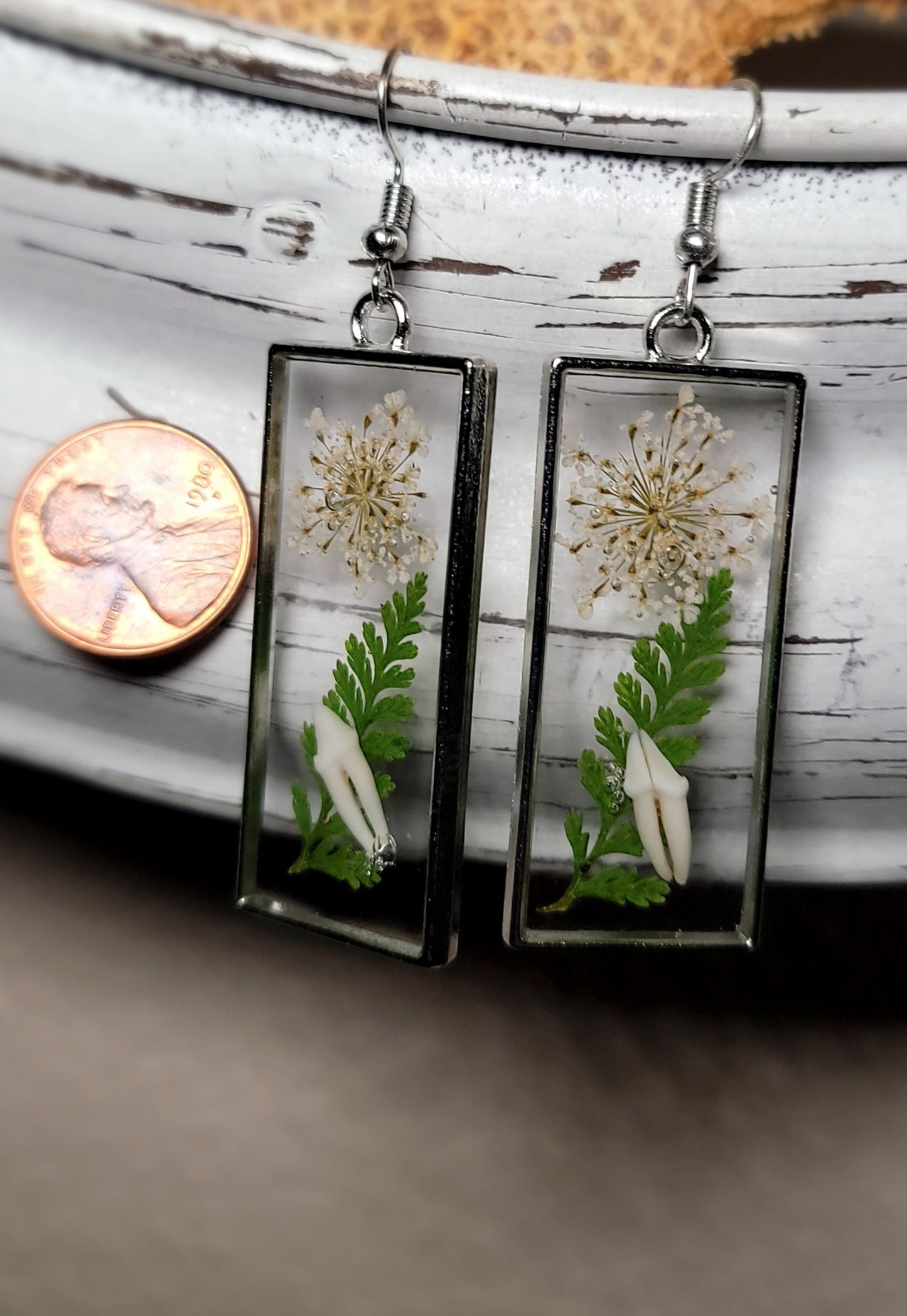 Raccoon Teeth with White and Green Floral Earrings