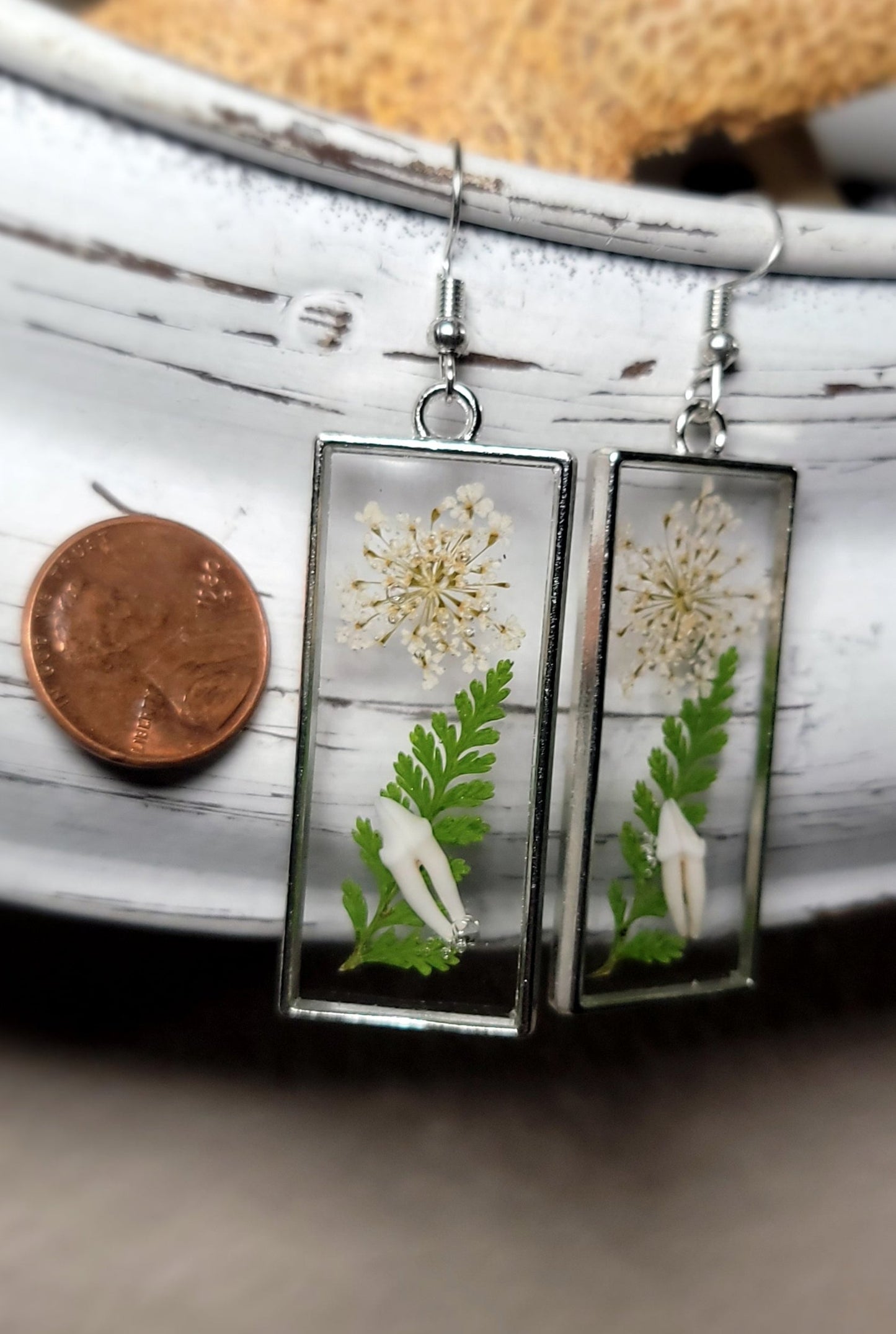 Raccoon Teeth with White and Green Floral Earrings