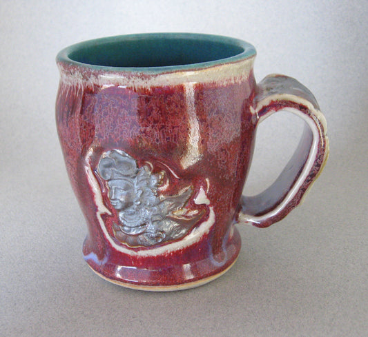 " Bali Mug " Winged Figure Design