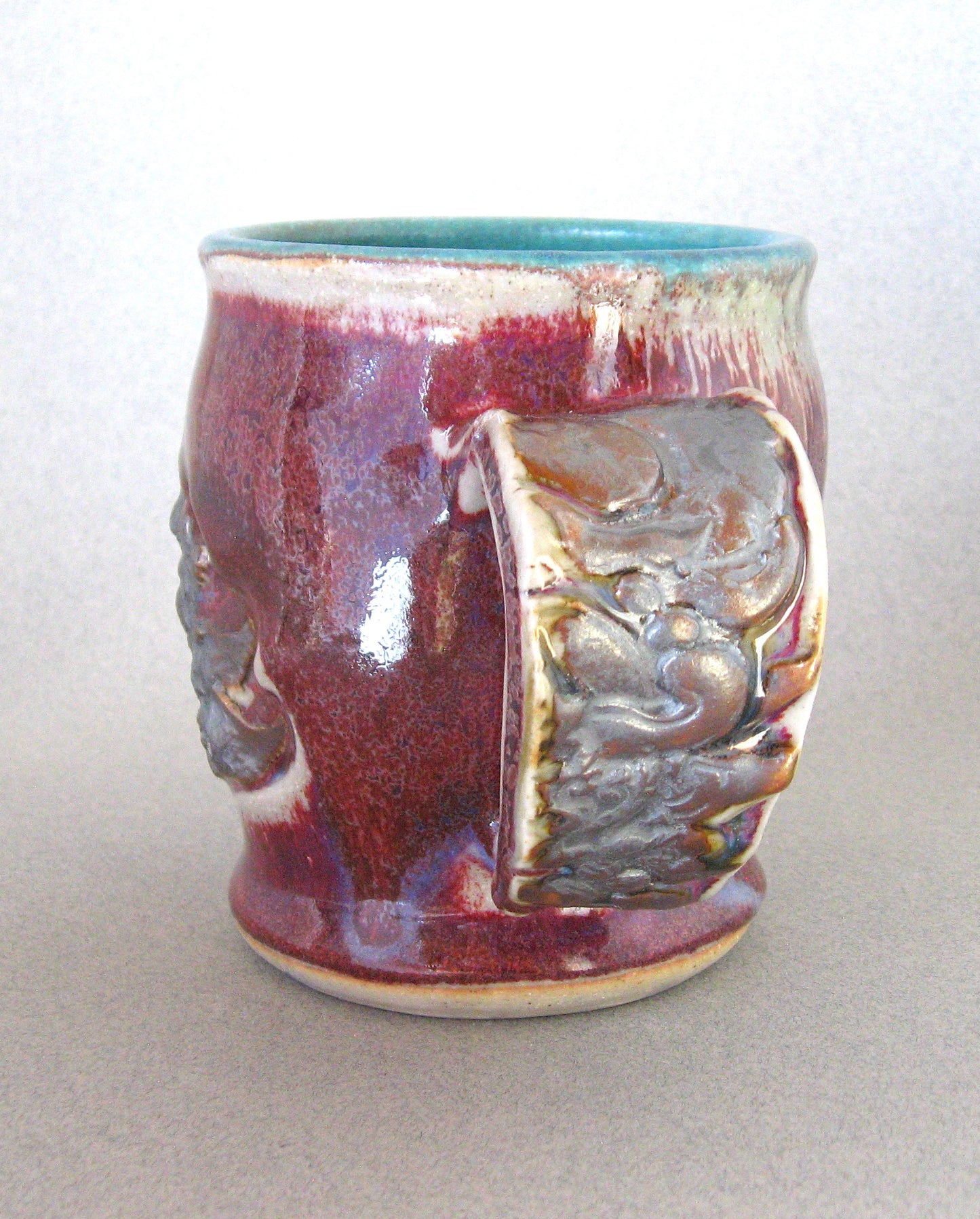 " Bali Mug " Winged Figure Design