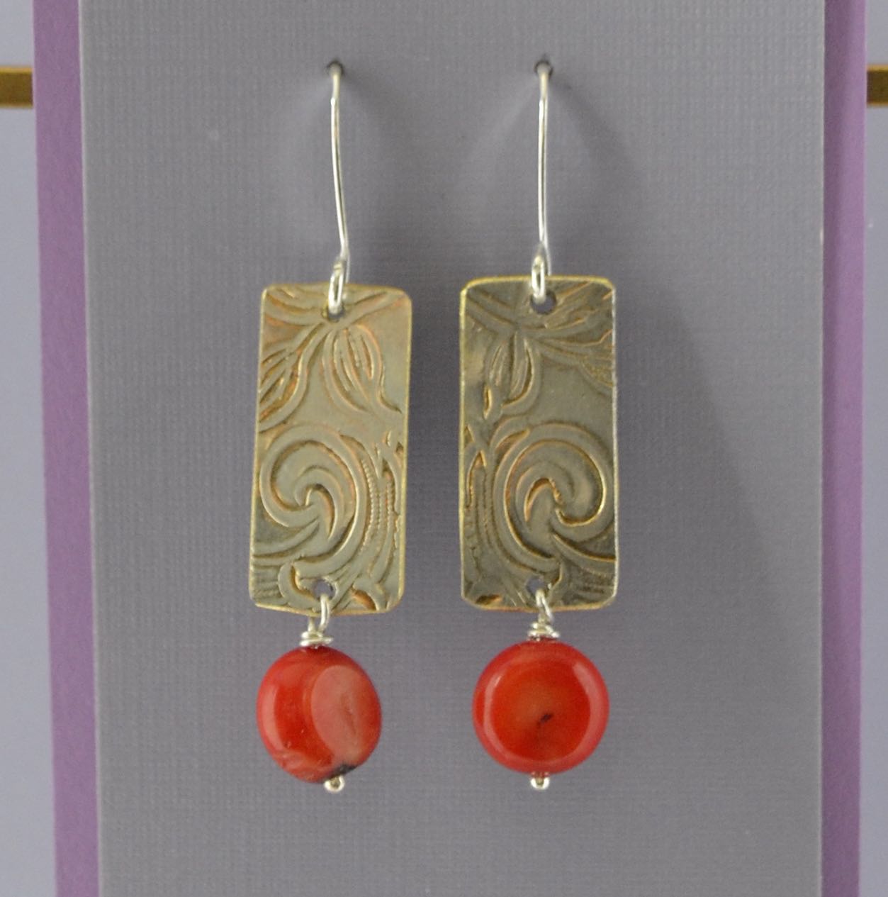 Red Apple Coral Pillows on Embossed Silver Plate with Spirals on Sterling Silver Wire