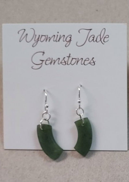 wyoming apple green jade quarter circle dangle earrings. hanging from sterling silver ear wires