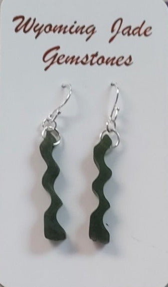 hand carved jade in a ribbon desing with sterling silver ear wires. Fun earrings
