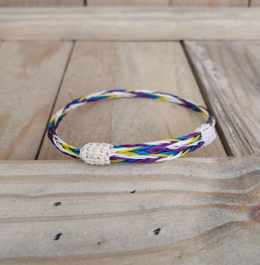 hand braided horsehair bracelet. Purple, teal, yellow and white horsehair.  natural and dyed color. adjustable bracelet