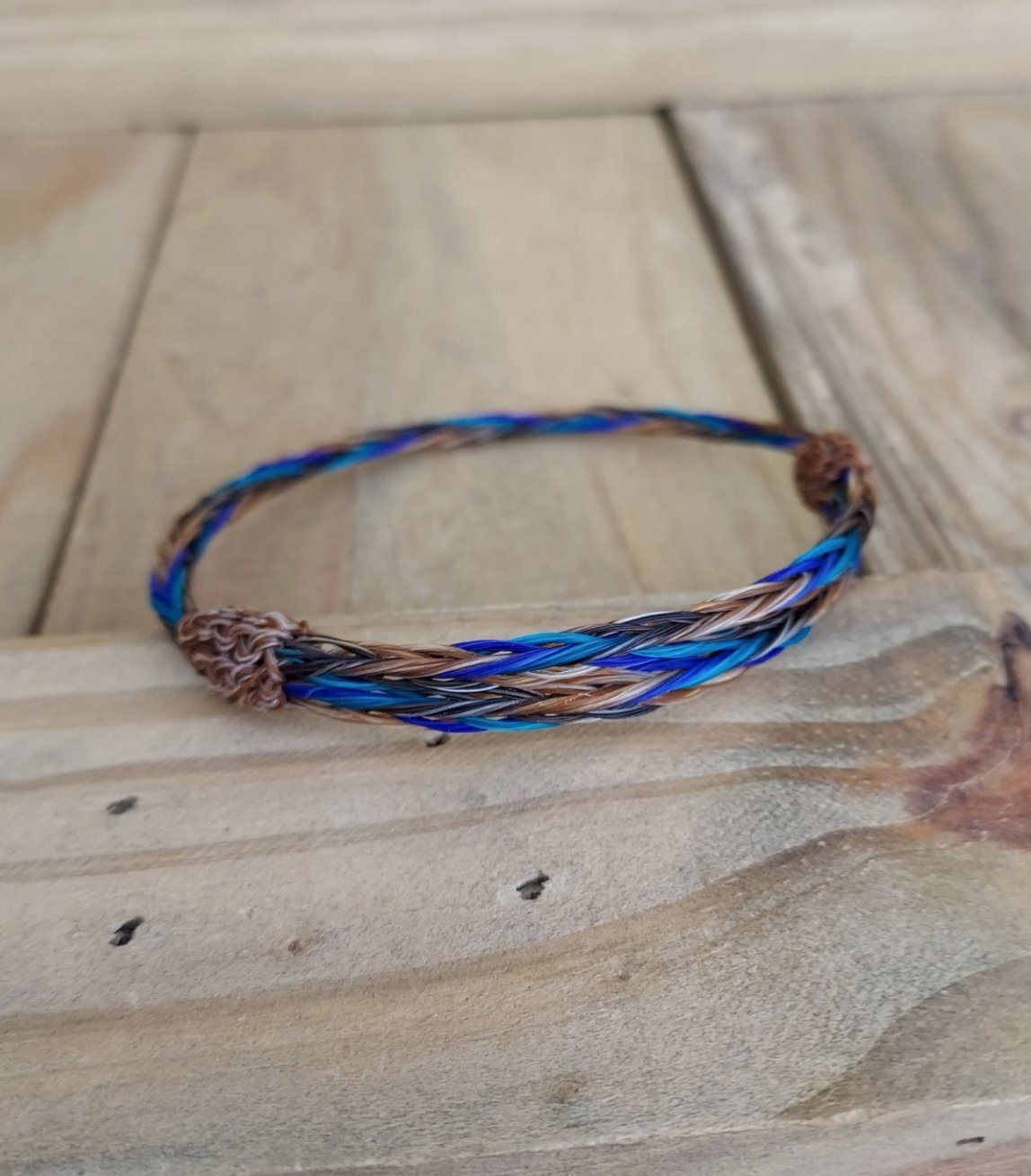 braided horsehair adjustable bracelet. natural and dyed hair. Light brown, teal and blue