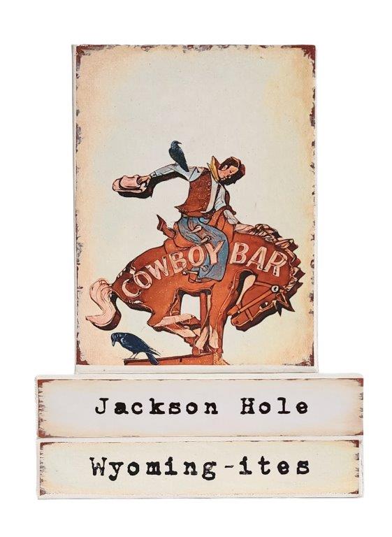 " Jackson Hole Wyoming-ites" Canvas Print Artist: Catherine Holt  Print on canvas with wooden framework   Copy from artists original  Sign of a bucking bronco and cowboy   Sign can be found above the Cowboy Bar in Jackson Hole Wyoming  Jackson Hole label below&nbsp; and Wyoming-ites label&nbsp; below it.