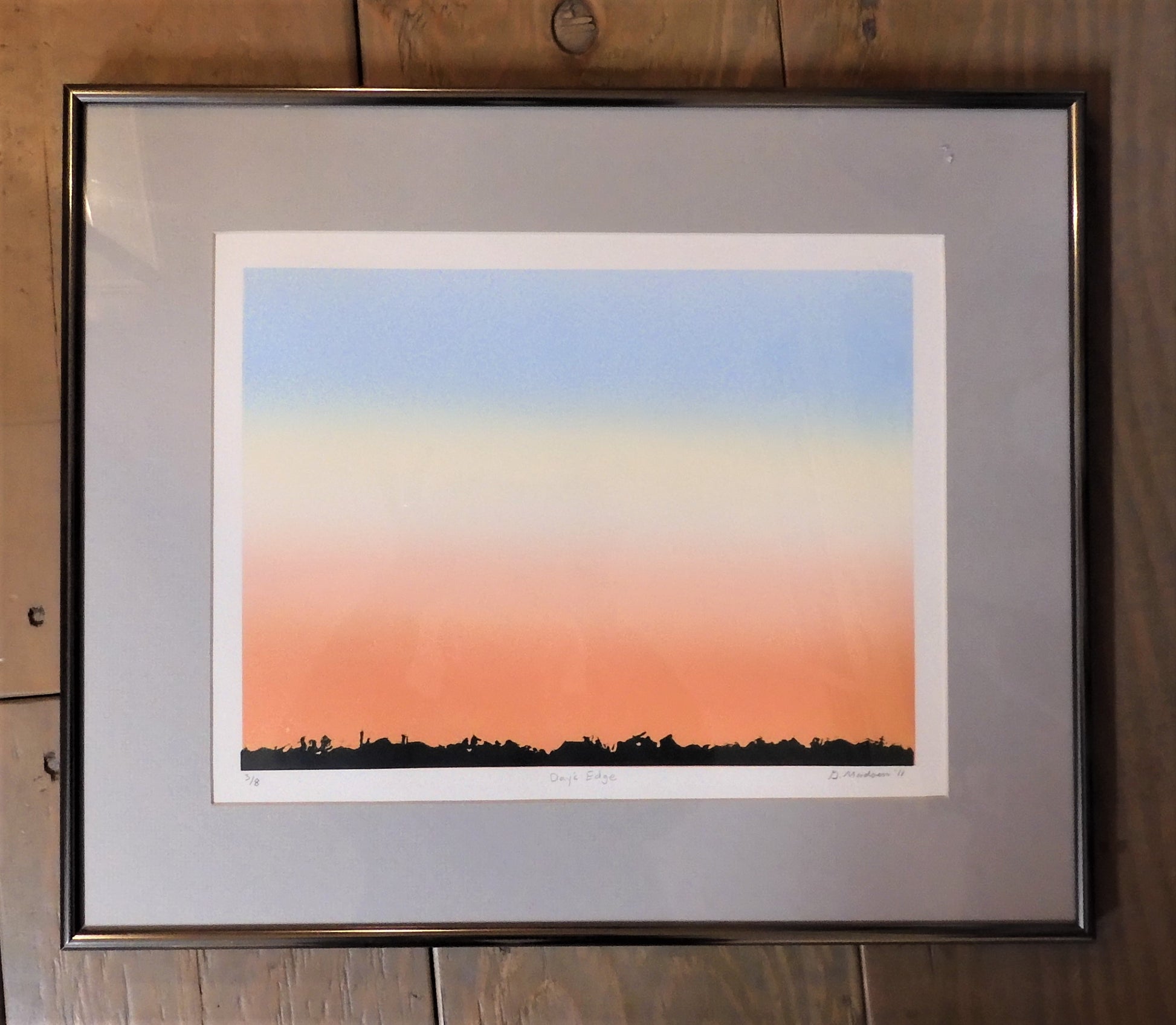 Days Edge, original lithograph relief print by Laramie, WY artist Ginnie Madsen. 15' x 18". Grey mat with browze tone frame, pastel sky